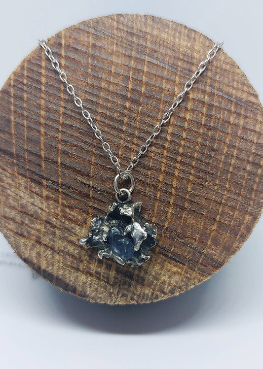 Handmade sterling silver pendant created through fire, salt, and intuition.